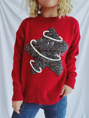 Scarlet knit jumper with embroidered starburst detail and white piping