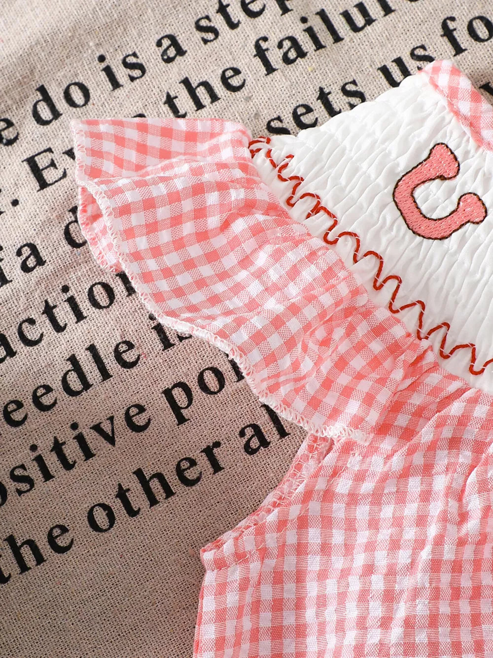 Children's Smocked Plaid Ruffle Sleeve Dress in Pink, close-up detail