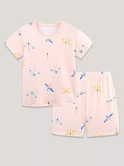 Toddler pajama set with short sleeves and shorts in pink with a dragonfly print.