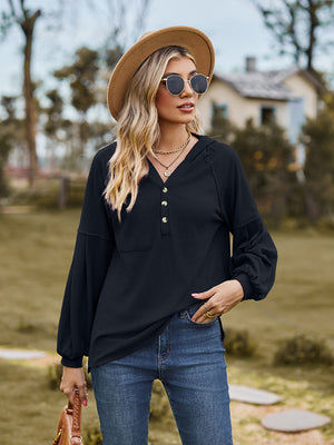 Black ribbed henley hoodie with balloon sleeves and button detail