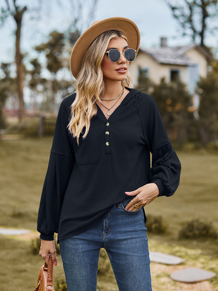 Black ribbed henley hoodie with balloon sleeves and button detail