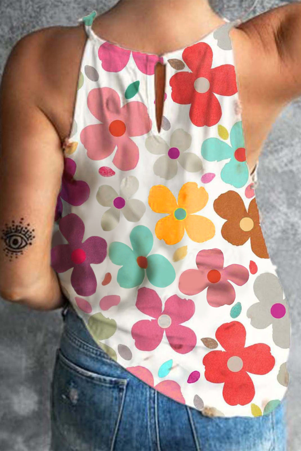 Floral halterneck tank top with keyhole back detail and colorful bloom pattern.