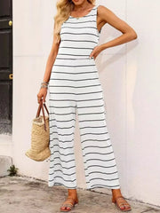 White sleeveless wide-leg jumpsuit with black stripes and a round neckline.