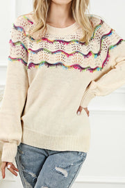 Cream acrylic knit sweater with rainbow scallop detail and open knit yoke.