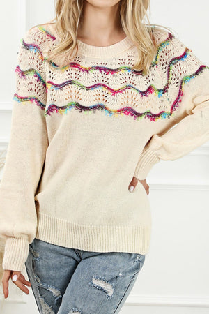 Cream acrylic knit sweater with rainbow scallop detail and open knit yoke.