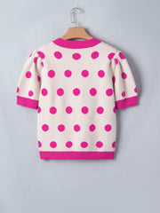 Cream knit top with hot pink polka dots and puff sleeves.
