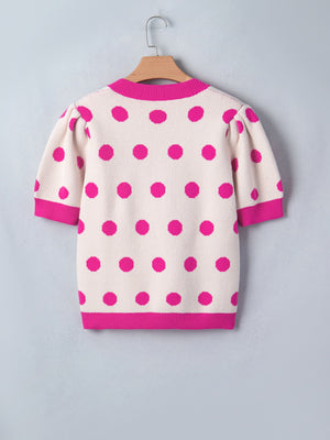 Cream knit top with hot pink polka dots and puff sleeves.