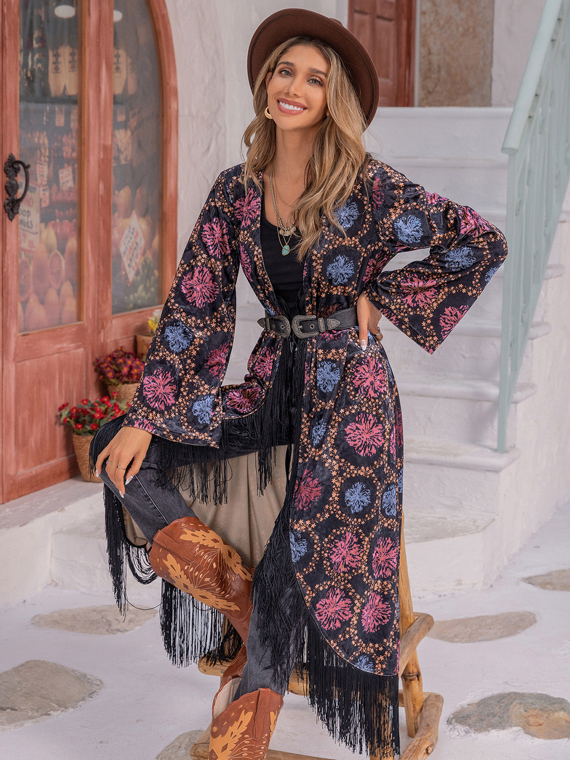 Bohemian floral duster with fringe, bell sleeves, and multicolor pattern.