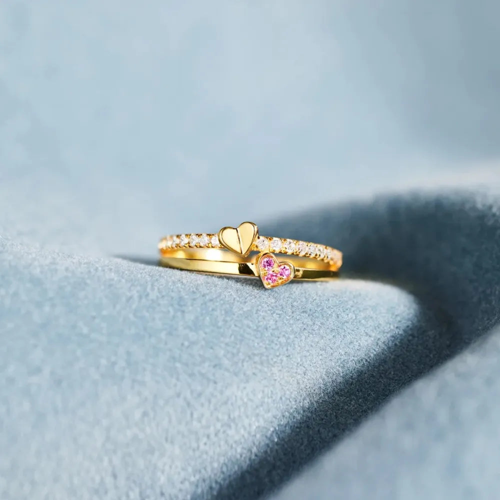 Gold layered rings with heart details and small stones