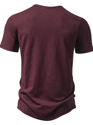 Men's burgundy cotton blend t-shirt with short sleeves and a curved hem.