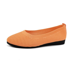 Tangerine breathable knit ballet flats with a flexible sole.