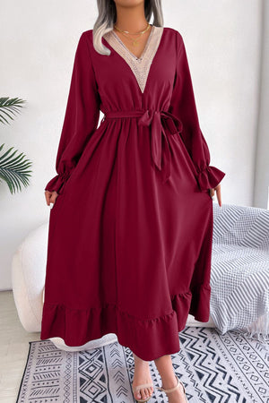 Wine midi dress with lace trim V-neck, tie waist, and ruffled hem.