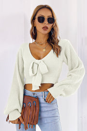 White acrylic knit crop sweater with tie-front and balloon sleeves