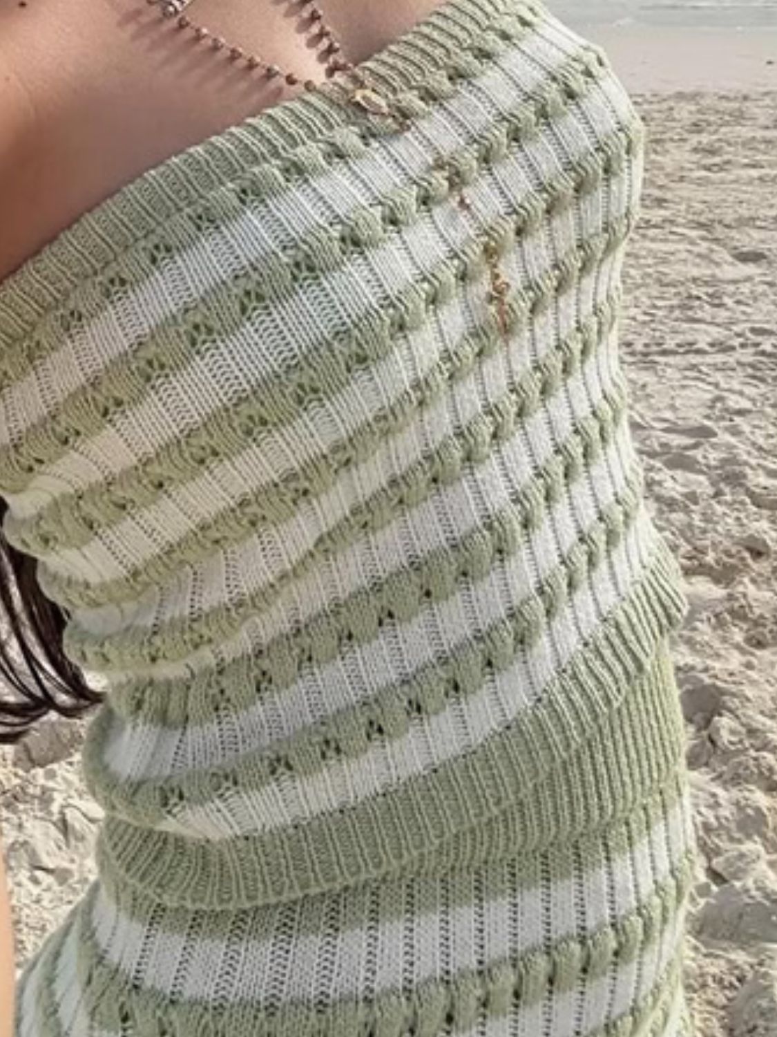 Green and white striped ribbed knit bandeau top with cutout details.