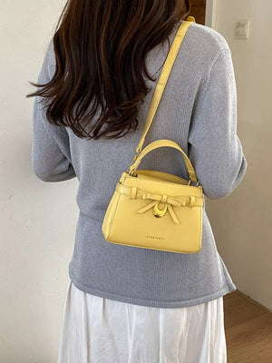 Bow Pu Leather Crossbody Bag in Yellow, front view