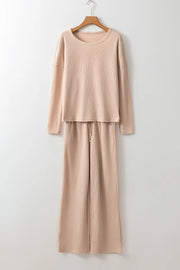 Tan textured ribbed lounge set with long sleeve top and wide leg pants with drawstring waist.