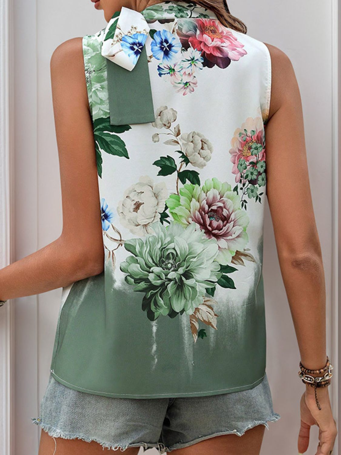 Painterly floral bow-neck sleeveless top in Gum Leaf with a green ombre hem.