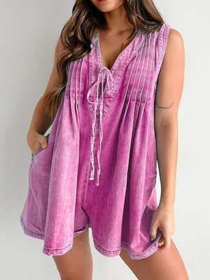 Pleated denim tie-front playsuit in hot pink with a V-neck and pockets.