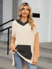 Waffle knit colorblock tunic with contrast pocket and hood.