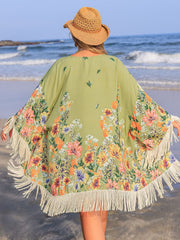 Sage floral print kimono cover-up with fringe detail and wide sleeves.