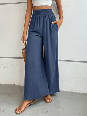 Dusty blue textured palazzo lounge trousers with smocked waist and pockets.