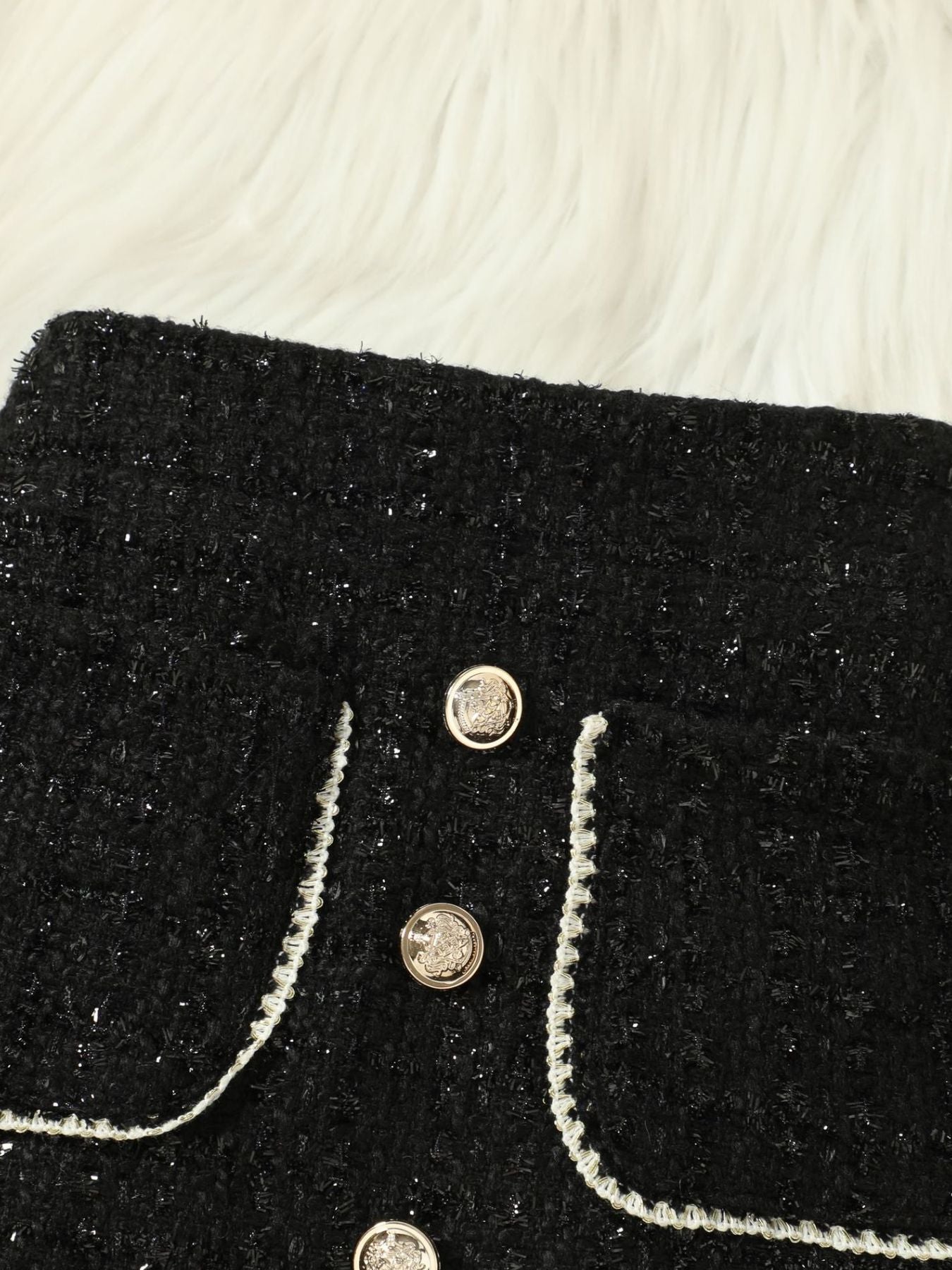Black tweed skort with decorative buttons and trim
