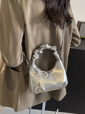 Silver ruched mini crossbody bag with pearl pendant and heart charm