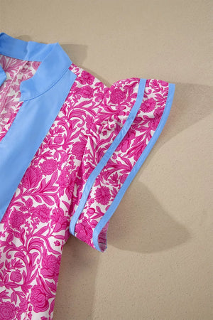 Vibrant floral midi dress with ruffle sleeves, blue collar and trim.