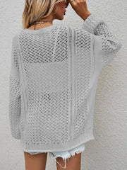 Open-knit acrylic cardigan in light grey with balloon sleeves and a relaxed fit.