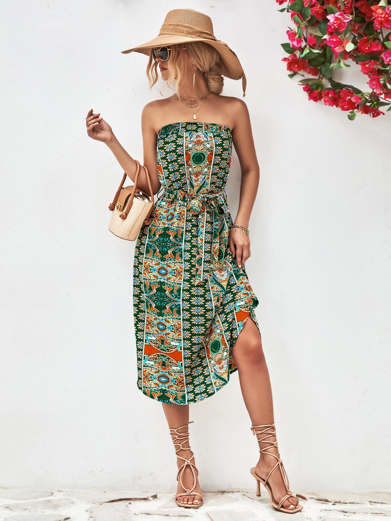 Green printed bandeau midi dress with asymmetric hem and belt.