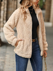 Tan textured teddy zip-up jacket with a diamond pattern and zip pockets.