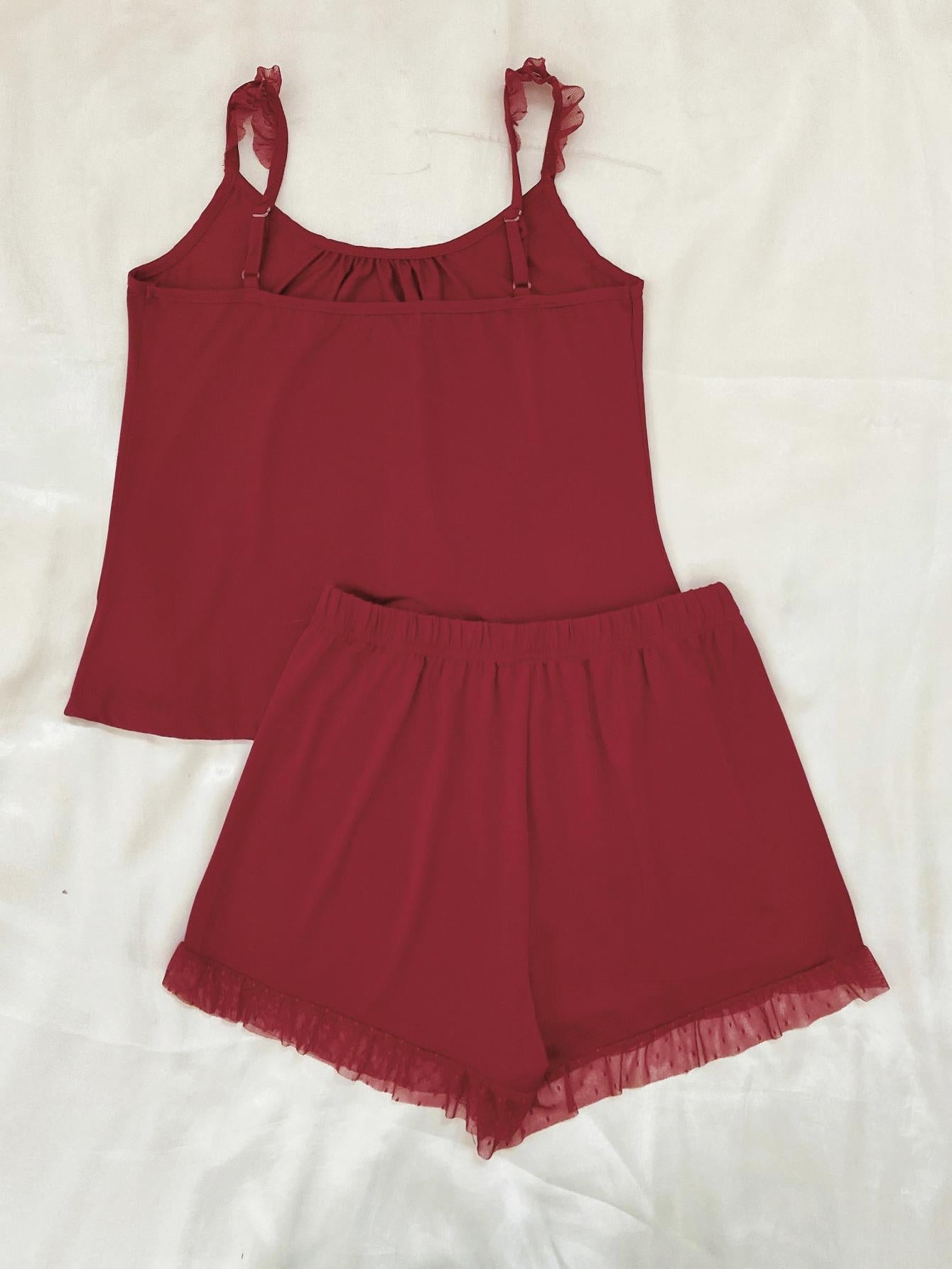Red cami and shorts set with ruffled mesh trim and adjustable straps.