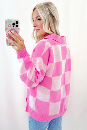 Checkered polo neck knit sweater in fuchsia pink with long sleeves.