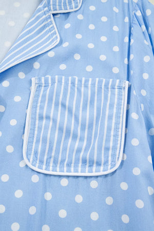 Blue polka dot viscose pajama shirt with white piping and a striped pocket detail.