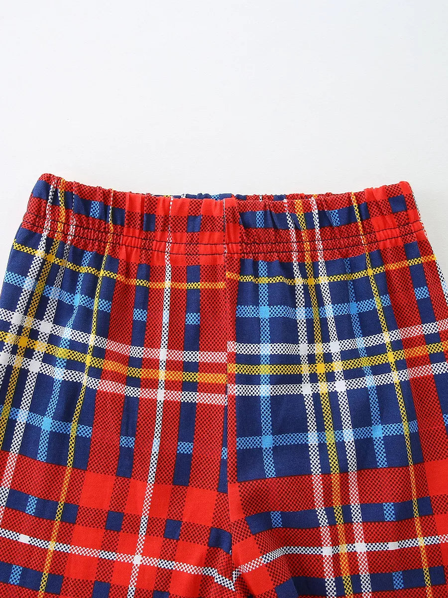 Baby shorts with red, blue, and yellow plaid pattern and elastic waistband.
