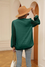 Green Swiss dot blouse with poet sleeves and lace cuffs, back view