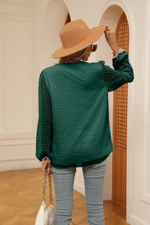 Green Swiss dot blouse with poet sleeves and lace cuffs, back view