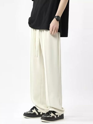Men's ivory wide leg sweatpants with drawstring waist and relaxed fit.