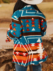 Southwestern print shawl collar jacket in peacock blue with geometric and triangle patterns.