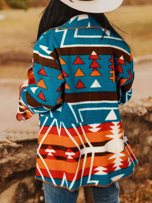 Southwestern print shawl collar jacket in peacock blue with geometric and triangle patterns.