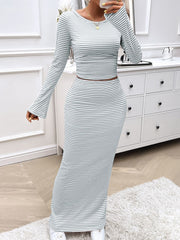 Light gray ribbed stripe crop top with bell sleeves and maxi skirt set.