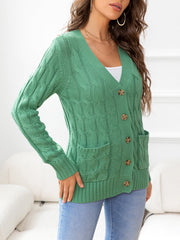 Green cable-knit cardigan with V-neck, buttons, and pockets.