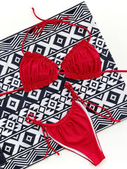 Red ruffle tie bikini set with white trim and string ties.