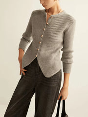 Grey ribbed knit cardigan with crew neck, gold buttons, and asymmetrical hem.