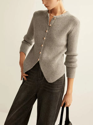Grey ribbed knit cardigan with crew neck, gold buttons, and asymmetrical hem.