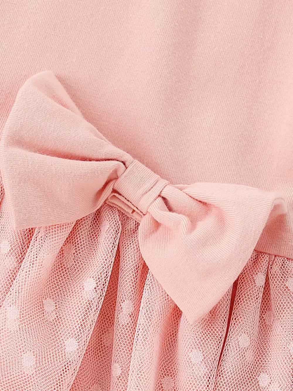 Pink baby dress with polka dot tulle skirt and bow detail