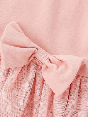 Pink baby dress with polka dot tulle skirt and bow detail