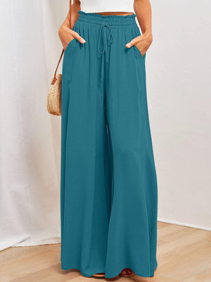 Textured drawstring palazzo trousers in deep teal with pockets.