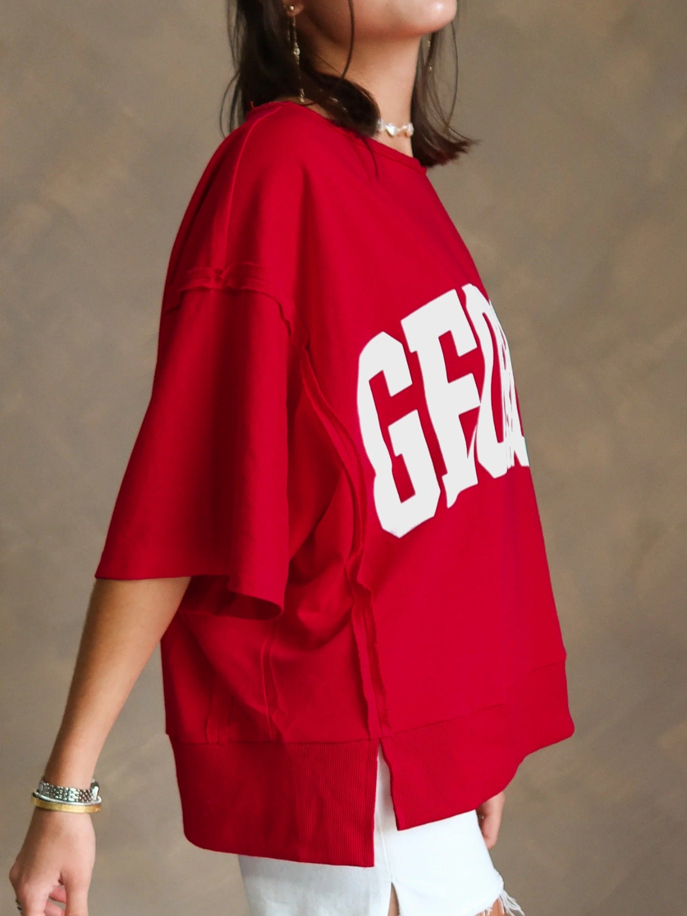 Red cotton blend t-shirt with bold white GEORGIA print, drop shoulders, and side slits.