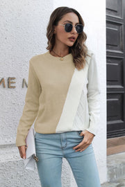 Beige and white acrylic diagonal knit sweater with cable detail.